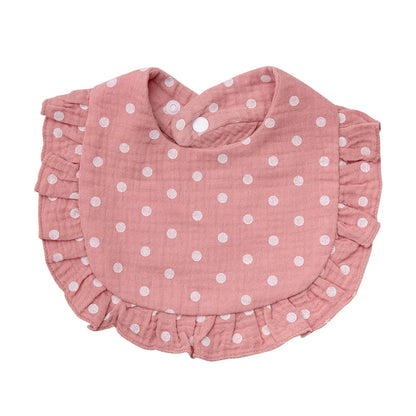 Detailed view of a durable snap closure on a floral print baby bandana bib, soft cotton