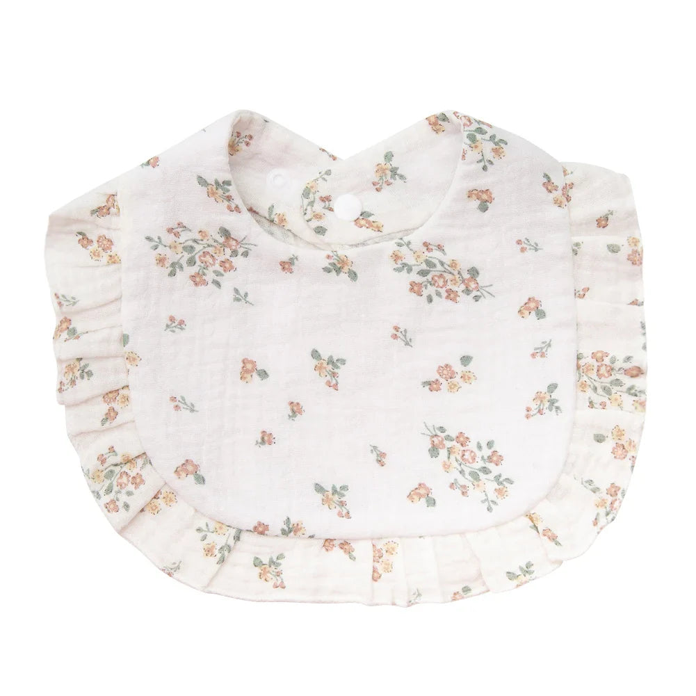 Stack of multiple unisex floral print cotton bandana bibs for baby shower gift