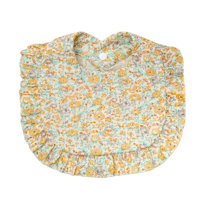 Infant dribble bib in soft cotton with an intricate floral and leaf pattern design