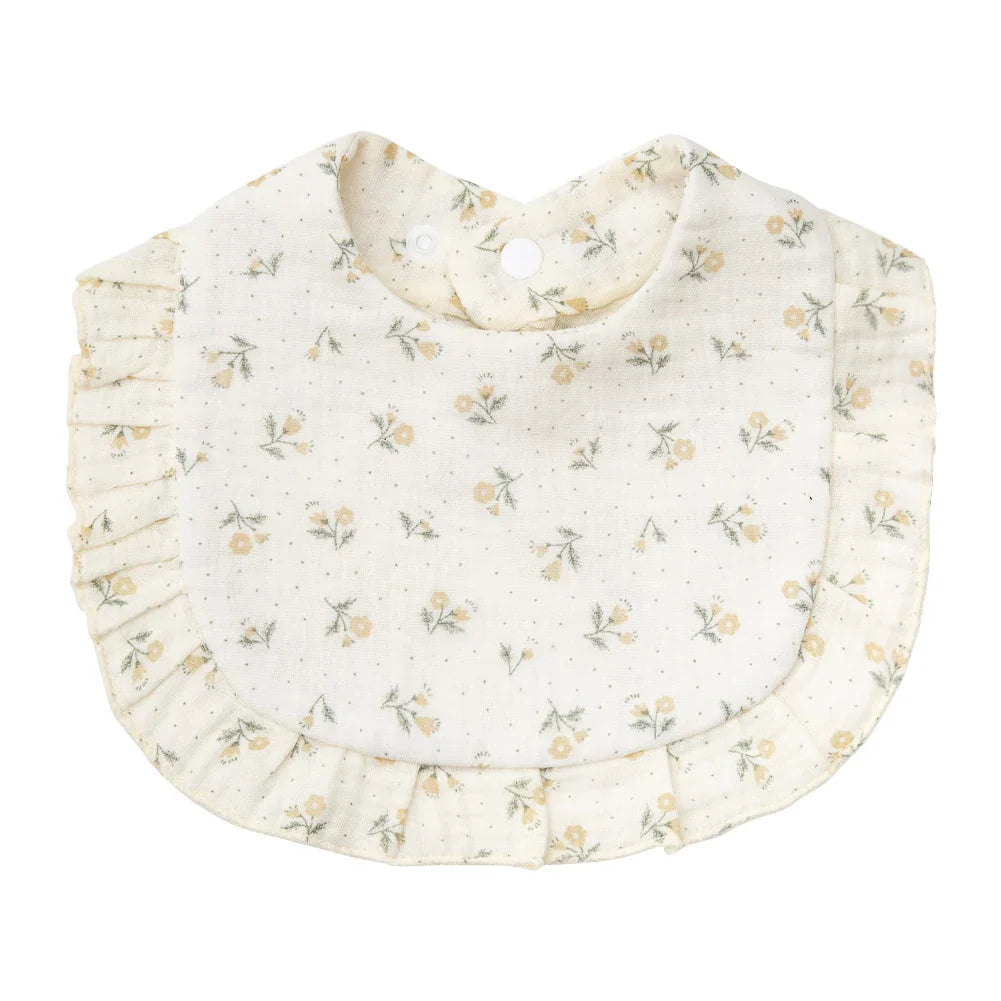 Baby's feeding scarf: a charming floral print cotton bandana bib on a wooden surface