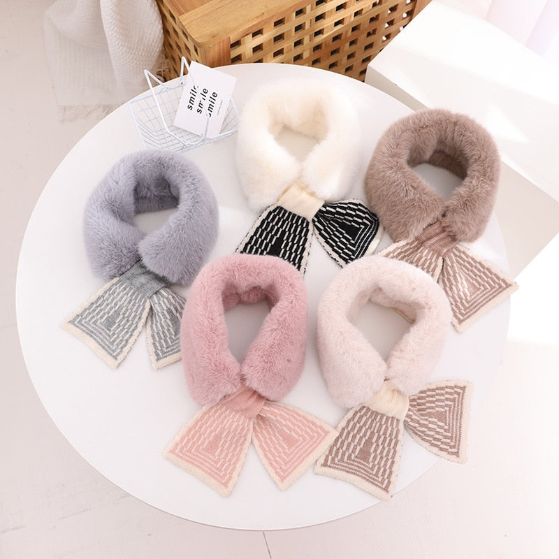Baby girl happily wearing a cream faux fur scarf, ideal for winter accessories and infant fashion