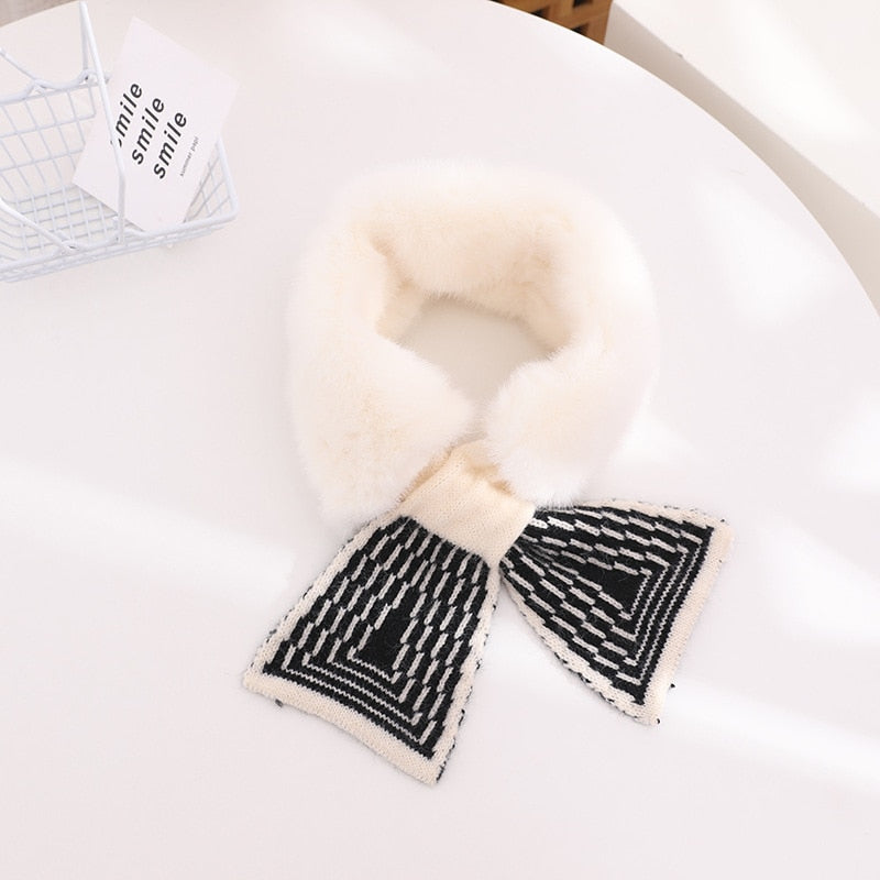 Delicate pink faux rabbit fur scarf, designed for baby and toddler girls, emphasizing softness and warmth