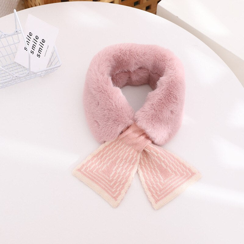 Close-up of the luxurious texture of a white faux rabbit fur scarf for baby girls, soft and warm