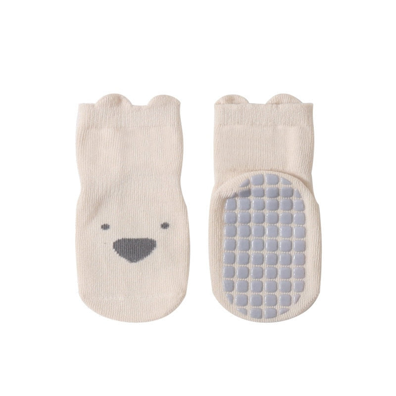 Stack of folded combed cotton toddler socks, showcasing their soft texture and durable design for newborns