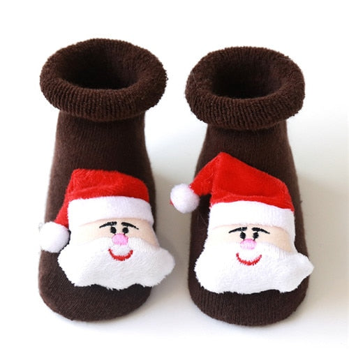 Baby Christmas socks with anti-slip features, displayed neatly folded as a holiday gift idea.