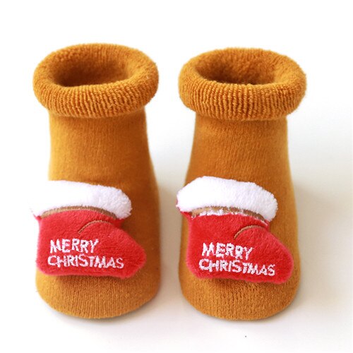 Detail of the anti-slip sole on baby Christmas socks, ensuring safety for little crawlers.
