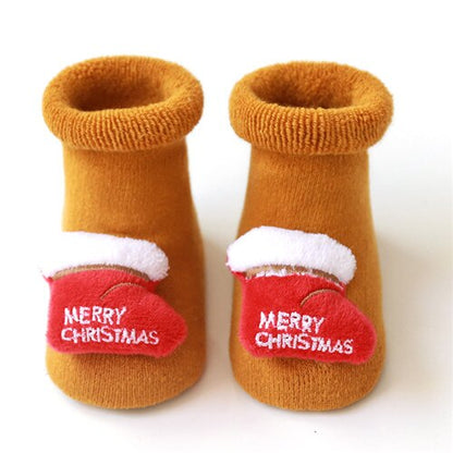 Detail of the anti-slip sole on baby Christmas socks, ensuring safety for little crawlers.