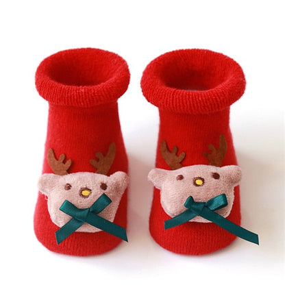 Festive anti-slip baby socks in a bright red hue, adorned with playful Christmas motifs.