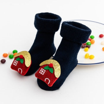 Baby's feet wearing anti-slip Christmas socks, illustrating how they prevent slips.