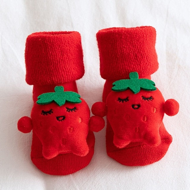 Red and white striped baby Christmas socks with non-slip grips, a perfect festive accessory.