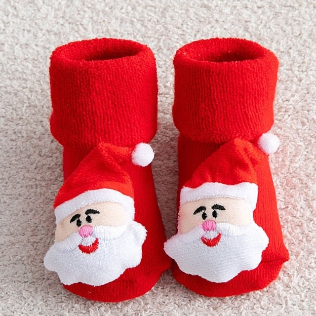 Collection of anti-slip baby Christmas socks in various festive designs, suitable for gifting.