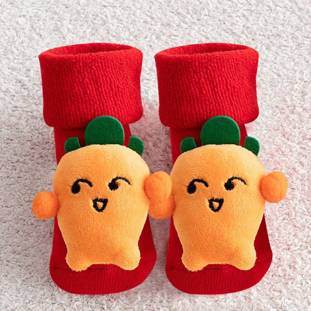 Top-down view of baby's anti-slip Christmas socks, emphasizing the safety grips and holiday cheer.