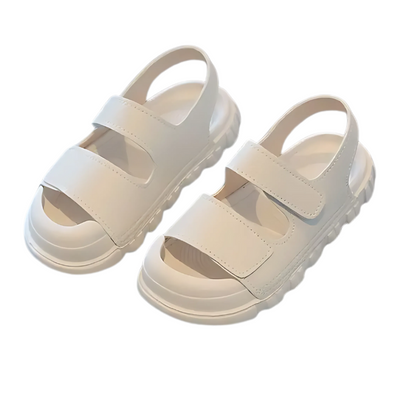 Overhead shot of two pairs of kids' outdoor sandals with toe protection, highlighting the durable Velcro and flexible soles suitable for summer.