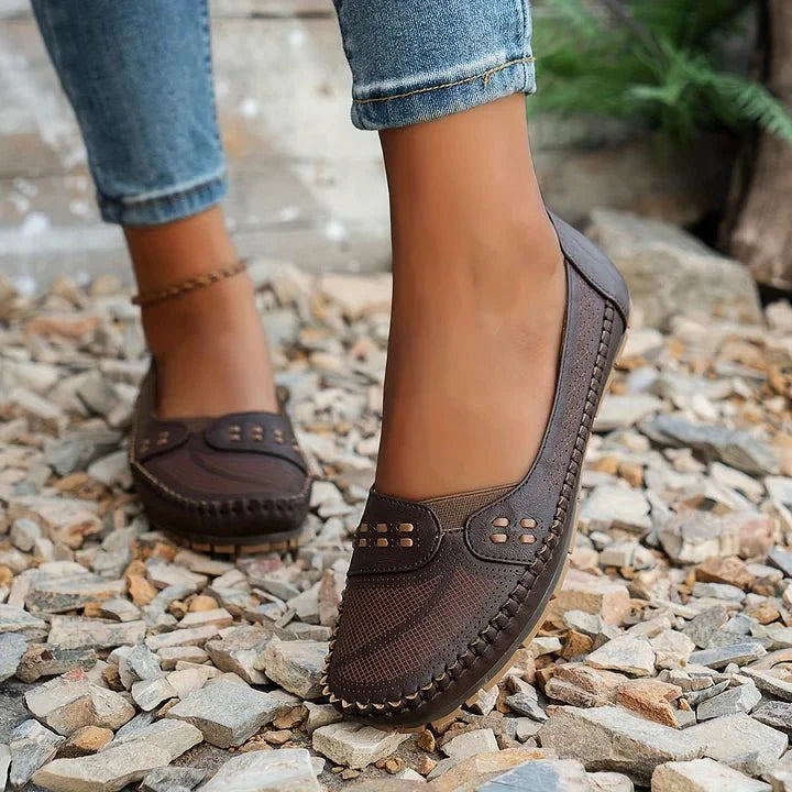 Women's orthopedic slip-on shoes with stylish perforated upper for breathability & comfort.