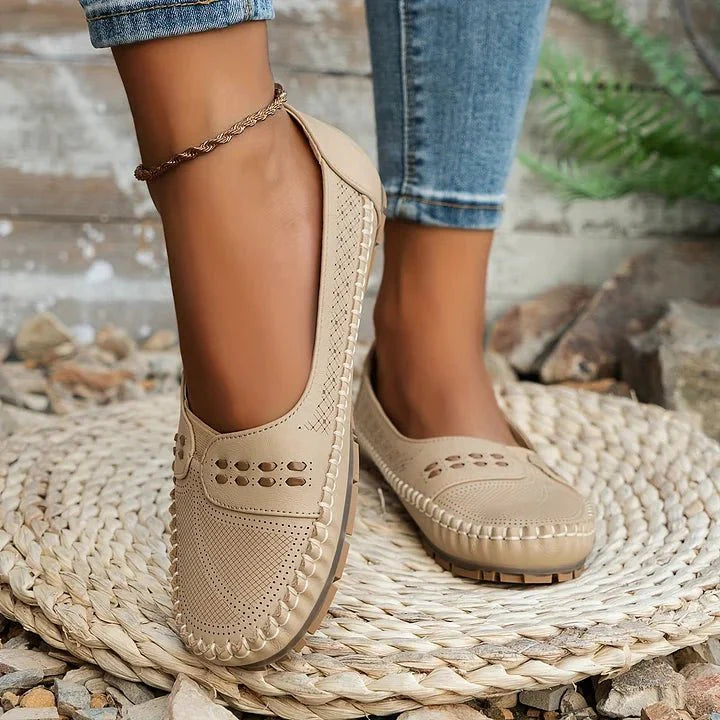 Stylish women's slip-on orthopedic loafers in a light color, perfect for spring fashion & comfort.