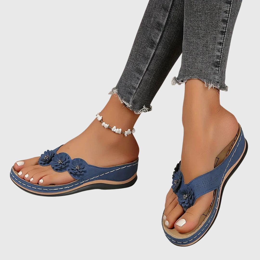 Front view of women's arch support flip flops, comfortable summer shoes for daily wear and foot support.