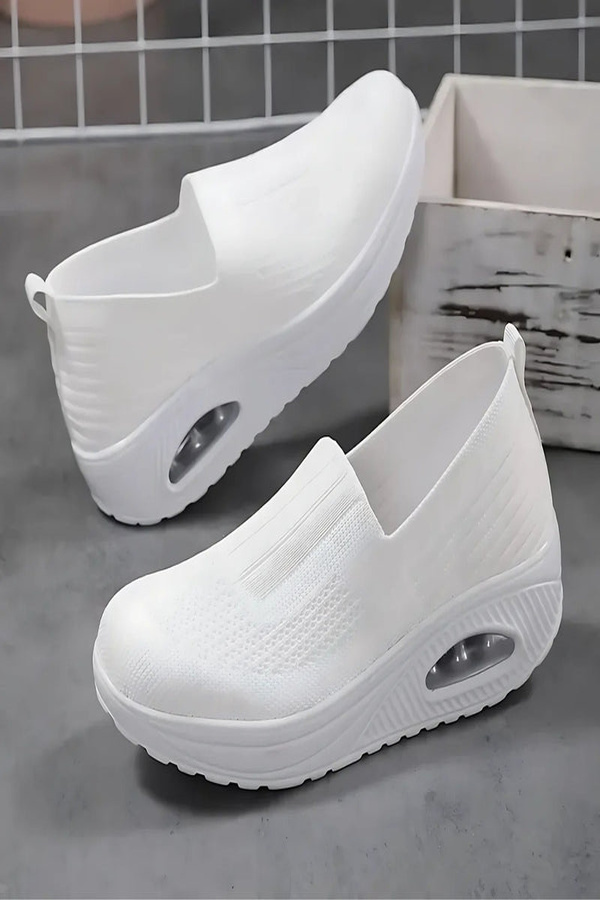 Pair of comfortable women's walking shoes, offering foot support & pain relief for everyday wear.