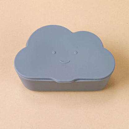 Cloud snack container with lid, in a diaper bag pocket, highlighting its portable design.