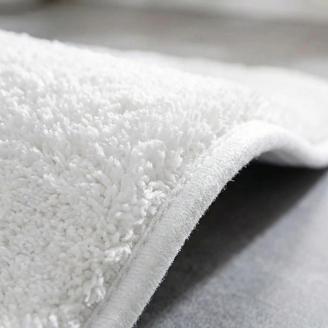 Highly absorbent & non-slip bath mat for bathroom, extra thick plush comfort floor mat with wave pattern.