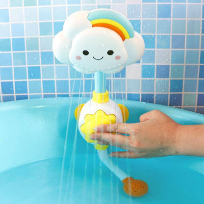 Toddler happily playing with Cloudy Bathtub Spray Toy, rainbow design, suction cup, water fun, in a tub