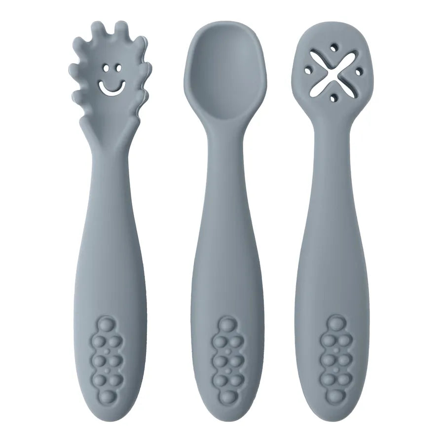 Full view of 3-piece silicone baby utensil set. Includes soft spoon, learning fork & another utensil.