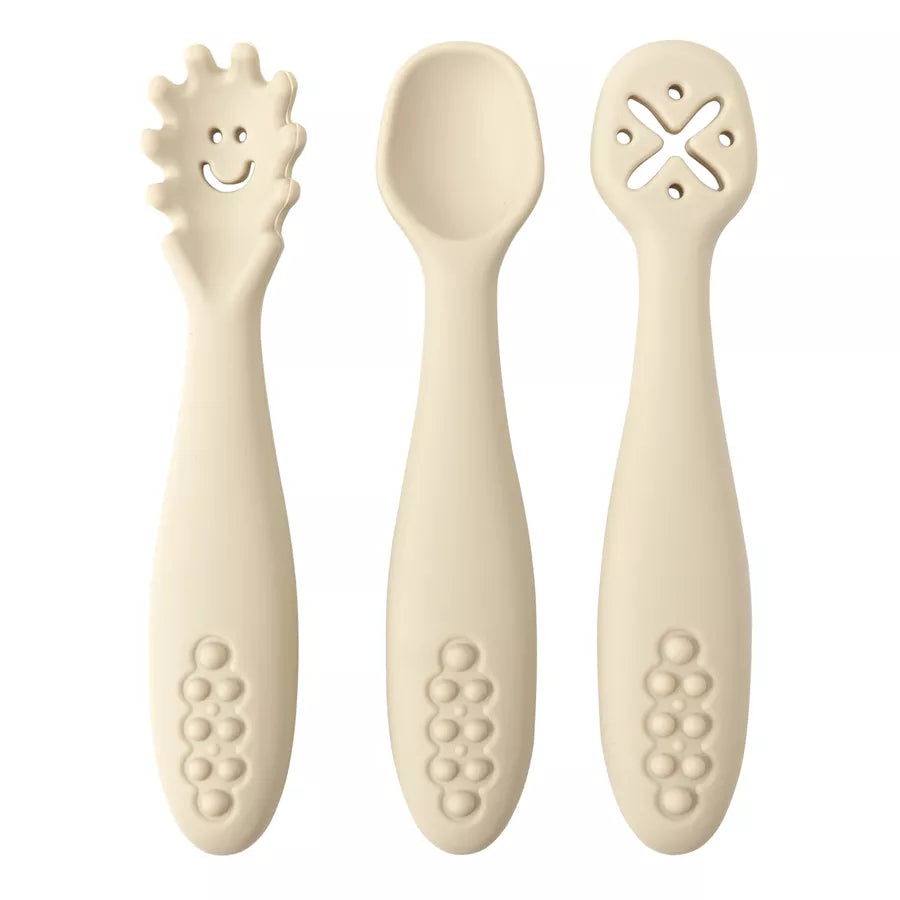Close-up of a soft silicone baby spoon, part of a 3-piece utensil set for infant self-feeding. First spoon.