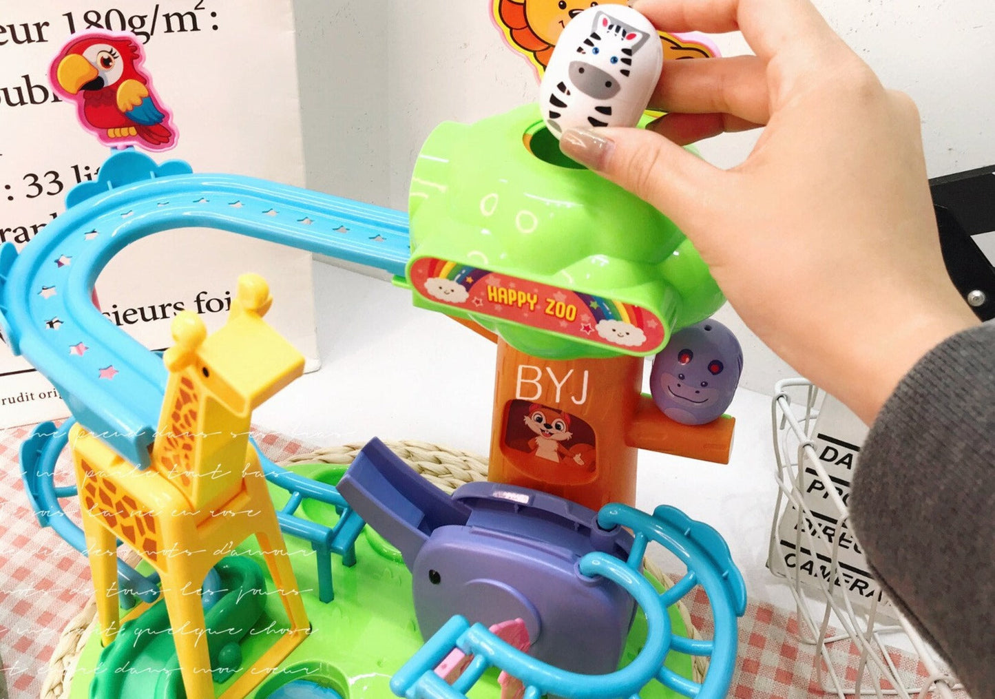 Child playing with educational animal slide toy, vibrant building blocks & fun creatures for kids.