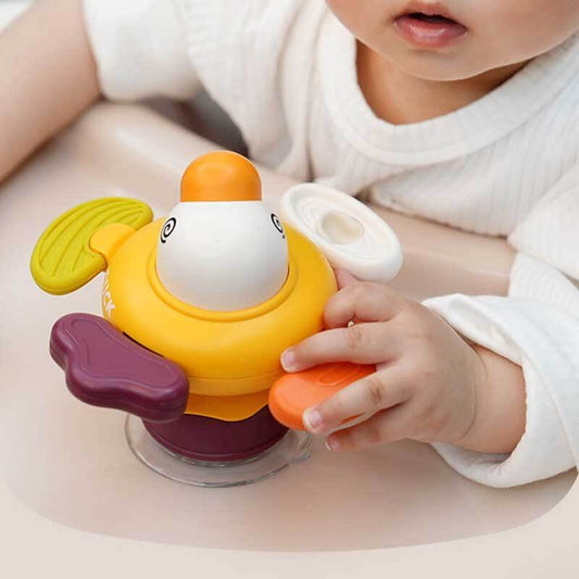 Colorful baby sensory spinner toy with suction cup base, perfect for high chairs or bathtubs, promoting developmental play.
