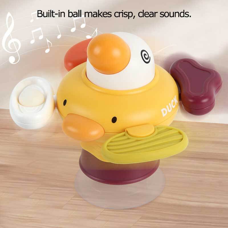 Developmental baby spinner toy featuring multiple colorful blades and a secure suction cup, ideal for hands-on sensory play.