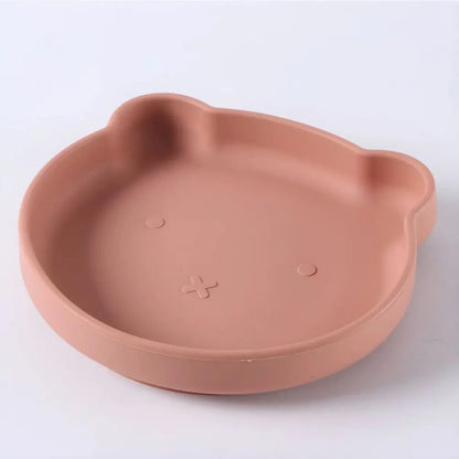 Baby cartoon silicone plate with suction, matching bowl & utensils for toddlers' feeding independence.