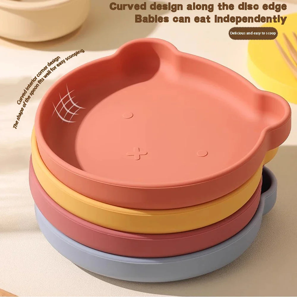 Complete baby feeding set: silicone plate, bowl, cup & utensils with cute cartoon for kids' mealtime.