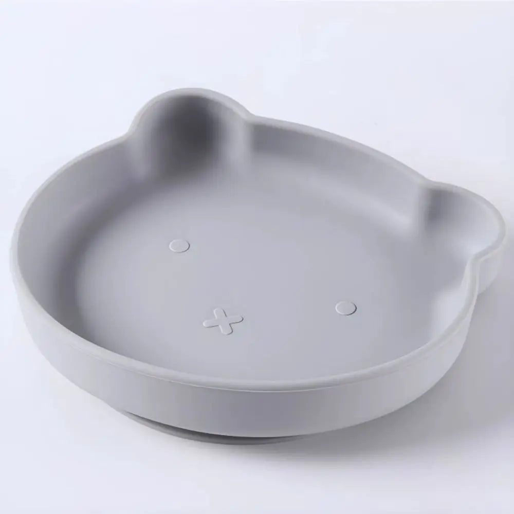 Durable BPA-free silicone kids dinnerware set with playful cartoon characters for infant meals.