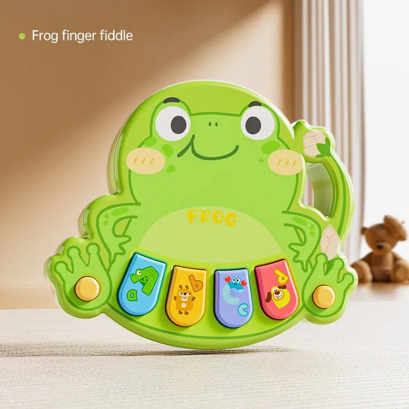 Happy child interacting with an early learning musical animal piano toy.