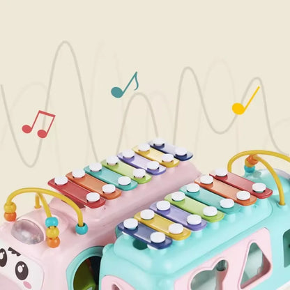 Toddler-friendly musical bus toy, a durable plastic interactive educational plaything for kids.