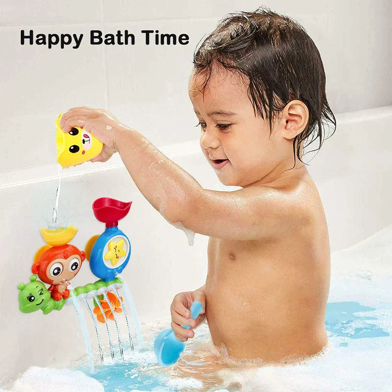Toddler playing with an educational water game bath toy featuring a suction cup track and slide