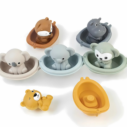 Colorful floating animal bath toys for baby's sensory water play, promoting motor skills development.
