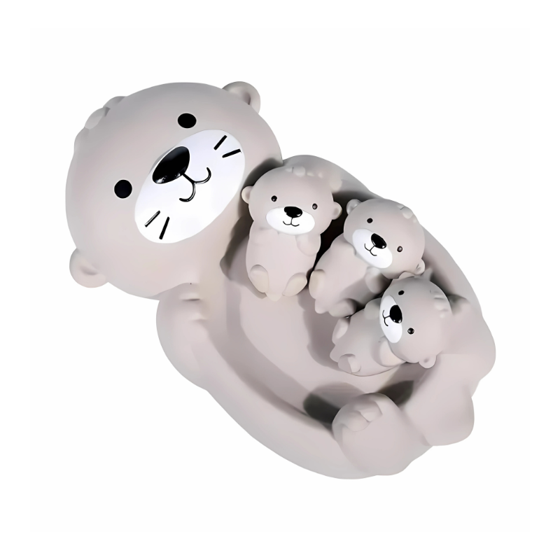 Baby enjoying sensory play with floating animal bath toys, perfect for early child development.