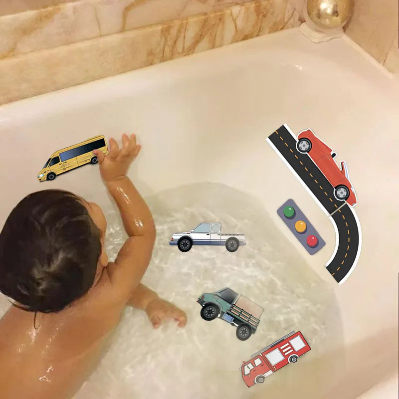 Toddler playing with various foam traffic bath toys, including vehicles and street signs in bath tub