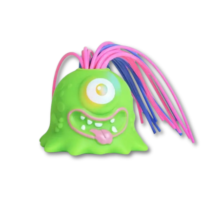Adult squeezing an interactive monster toy, demonstrating its stress relief benefits.