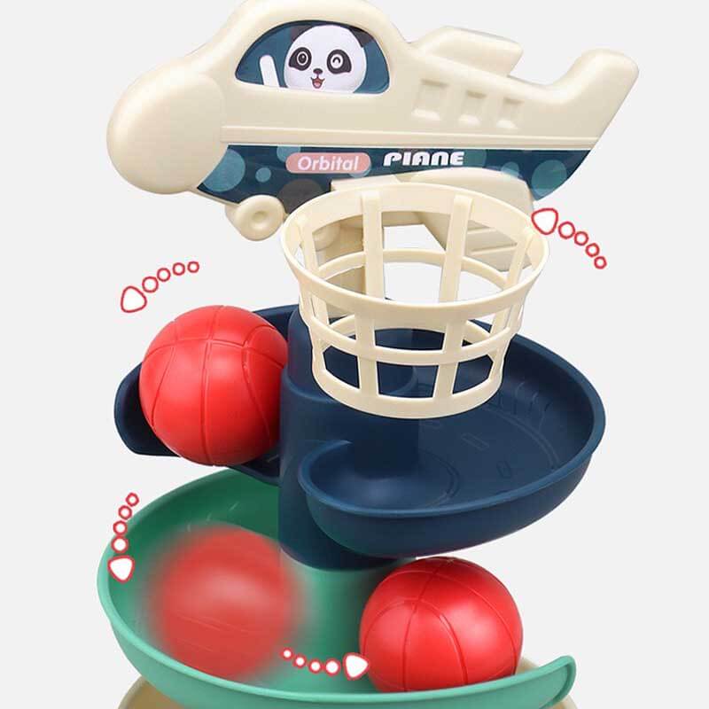 Close-up of a plastic interactive ball drop toy showing bright colors and smooth edges