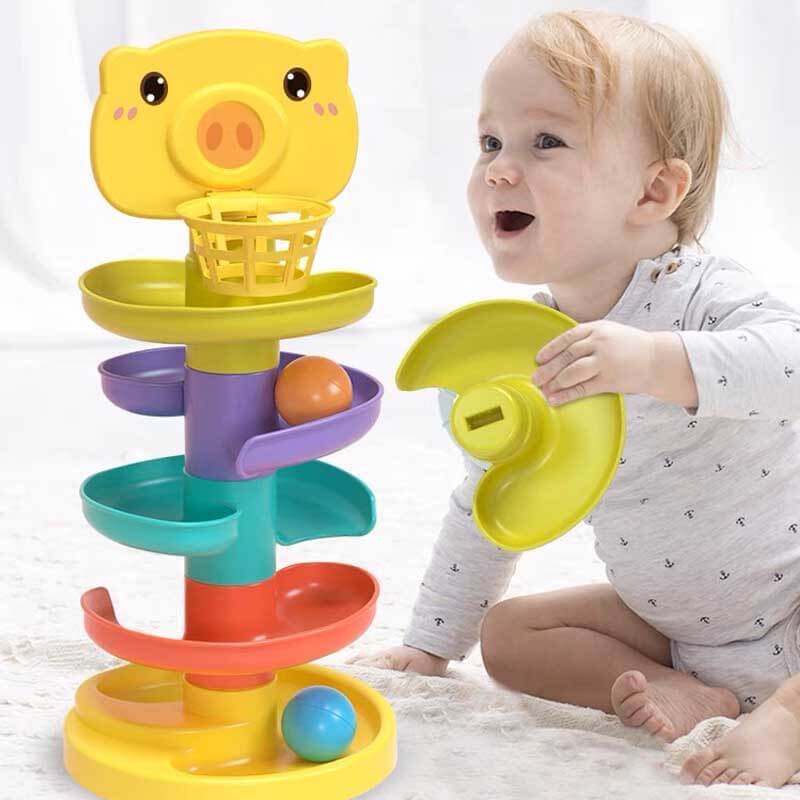 Detail of a ball dropping through a level of the interactive stacking game for toddlers