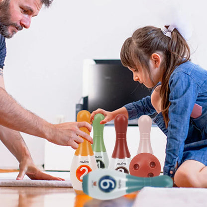 Durable plastic kids bowling set for indoor family fun, featuring brightly colored pins and a small bowling ball.