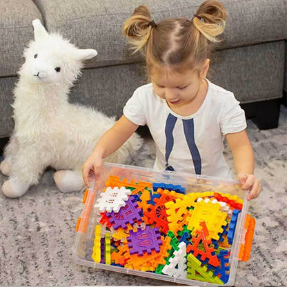 Toddler playing with red, blue, yellow interlocking waffle building blocks, educational toy