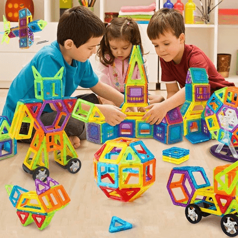 Kids' hands assembling a colorful magnetic building toy castle, demonstrating creative play & educational engagement.
