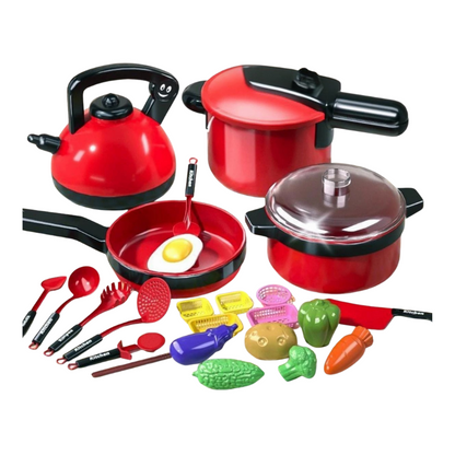Close-up of a child's hands arranging miniature food and dishes from an imaginative play cooking toy set.