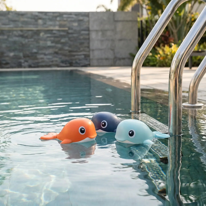 Colorful kids' wind-up floating whale bath toy set for toddlers. Battery-free water playtime fun.