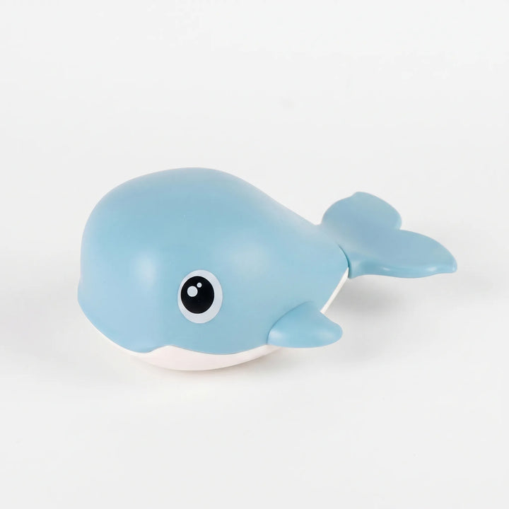 Set of colorful wind-up floating whale bath toys for kids. Encourages water playtime fun.