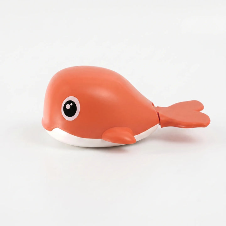 Fun floating whale bath toy set for kids. Wind-up action for engaging, battery-free water playtime.