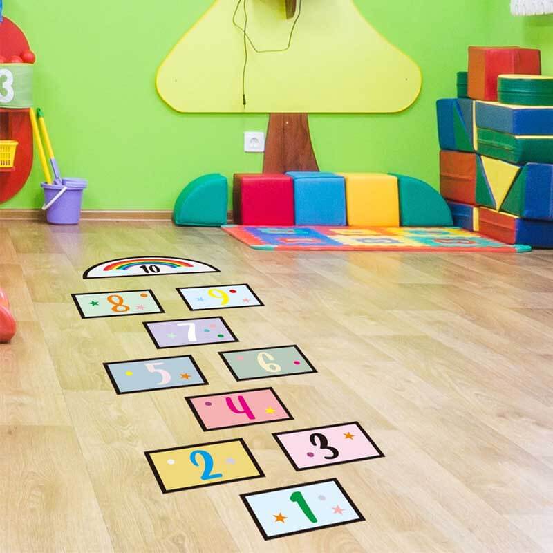 Nursery decor with large, easy-to-read number stickers, promoting learning through play for children.