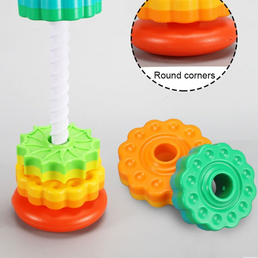 Bright rotating stacking toy, an engaging activity for babies and toddlers to improve coordination.